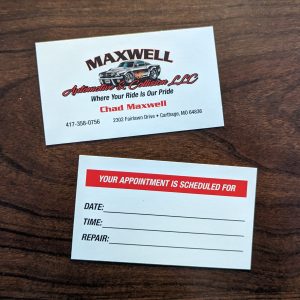White business card with black and red lettering on front that says "Maxwell Automotive & Collision LLC. Where Your Ride Is Our Pride." With name and contact info. Scheduling Info on the back