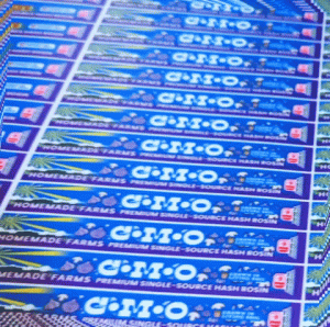 Panning across a sheet of rosin cannister labels for Homemade Farms in Joplin, MO.