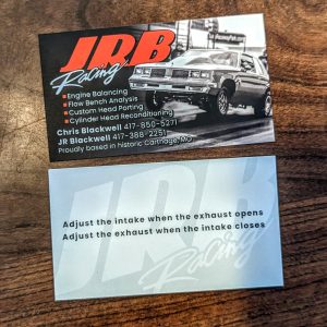 Black and white on front and back with the exception of the letters JRB on the front. Racing and services and contact information and a picture of car on front and a quote on the back.