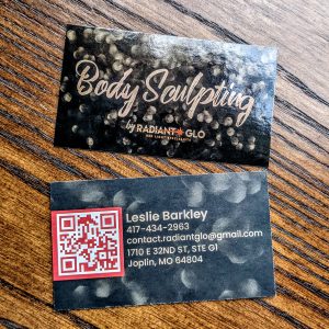 Black glossy front with Body Sculpting by Radiant Glo on front in a gloss finish with a textured back ground. Back of card has a QR code as well as contact information