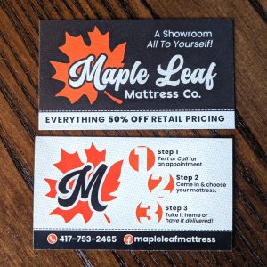 Front and Back business card. Front is black background with orange logo and white lettering with contact information. The back is the opposite with white background and black lettering with orange logo.