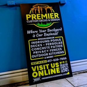 Large sign with logo and information about what they offer as well as the contact information