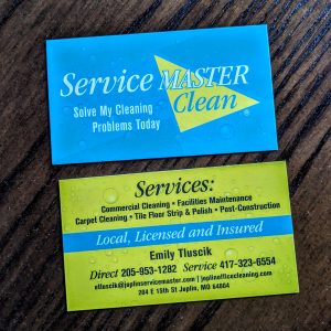 Turquoise with white Service Master lettering on front with Yellow half triangle. Back is yellow with information about Service Master as well as a turquoise stripe with local, licensed and insured.