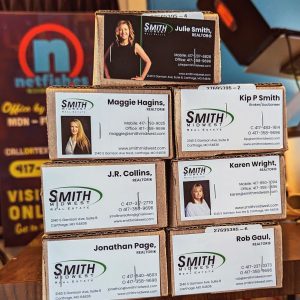 Multiple business cards with Smith Midwest and information on them.