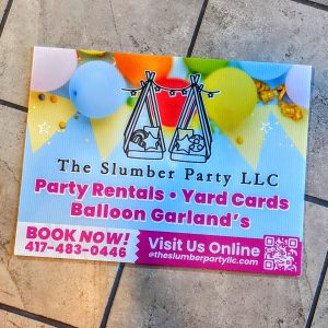 Multi color yard sign. Variety of balloons with black outline of teepee and the name of business. Pink coloring for services offered. Also has QR code.
